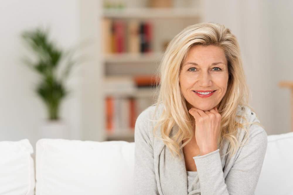 Smiling woman sitting on a couch