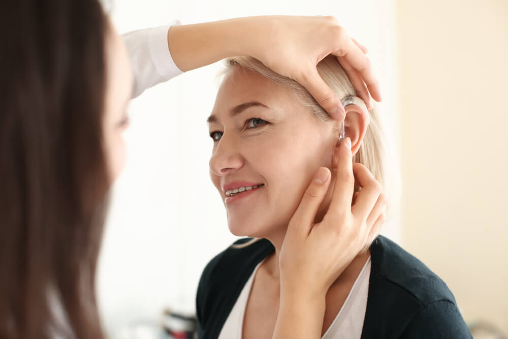 Woman being fitted for a hearing aid\