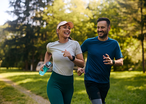 Man smiling with someone behind him