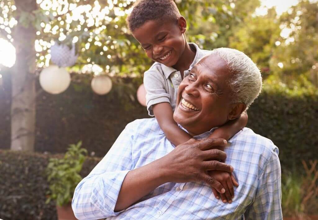 Man playing outside with grandson